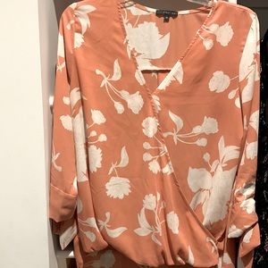 Beautiful blouse with long back and tied sleeves